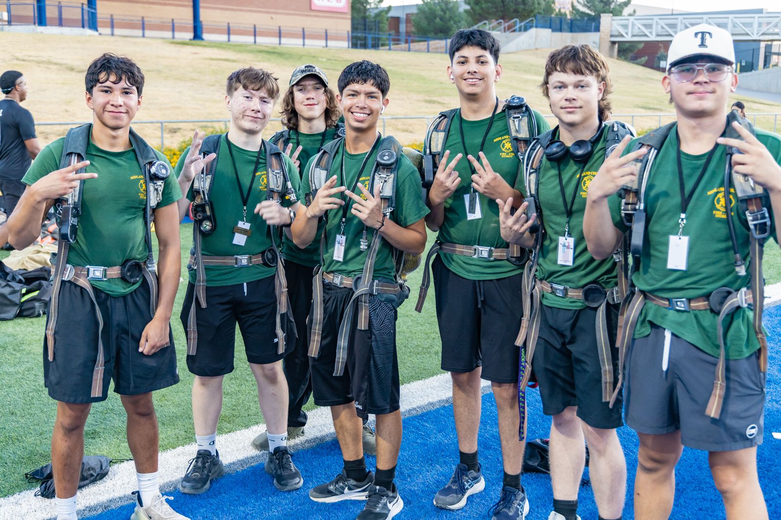 Volunteer group in matching shirts on the stadium field