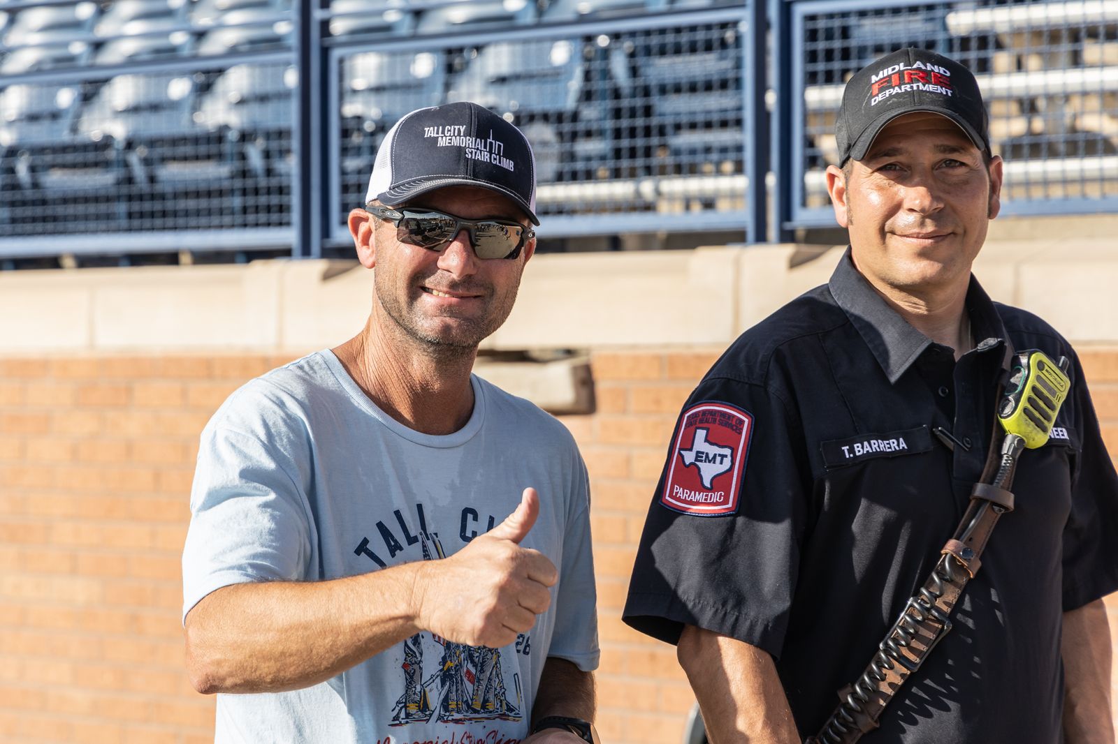 Two first responders giving a thumbs up