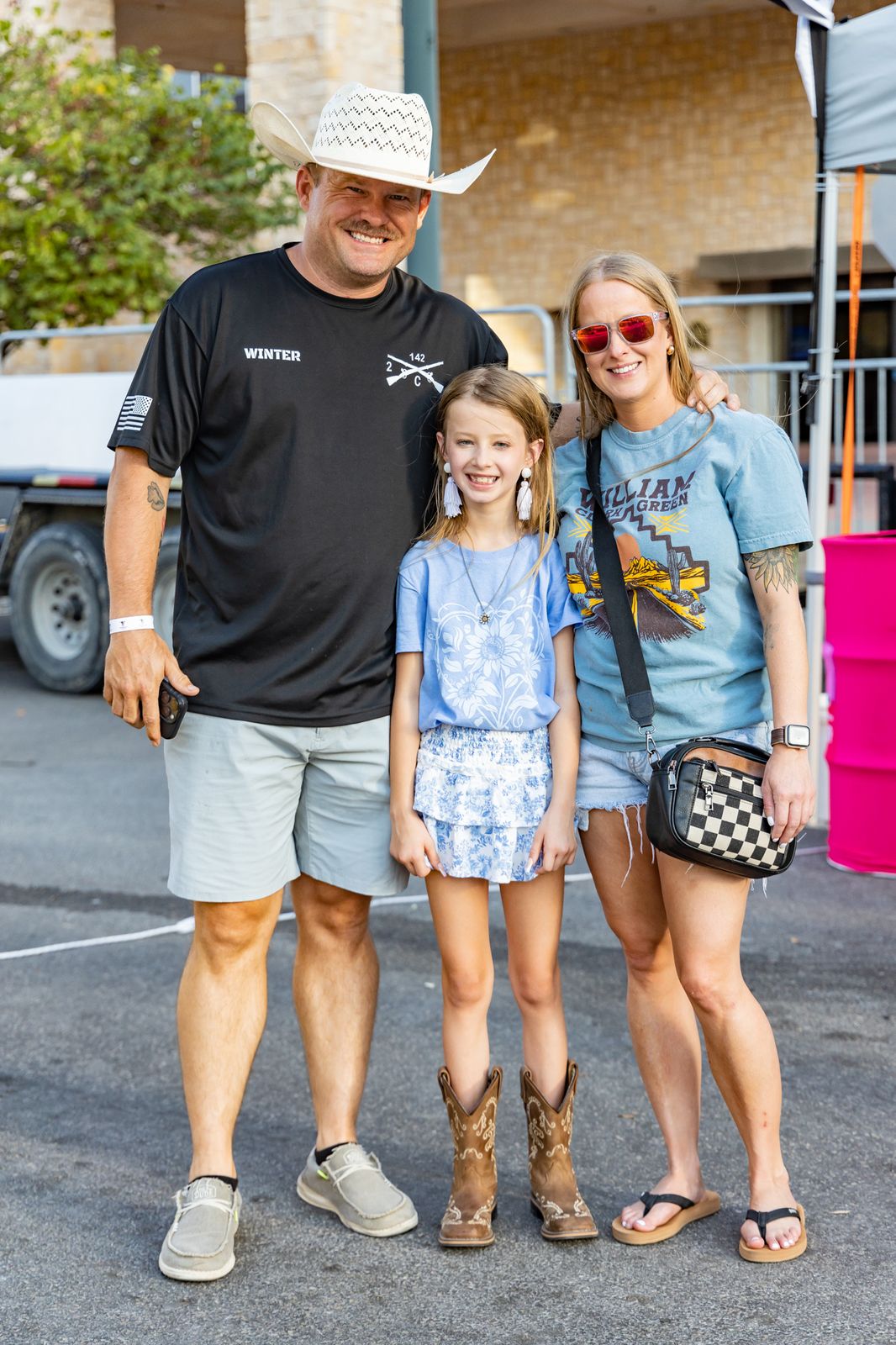 Family posing together at the concert