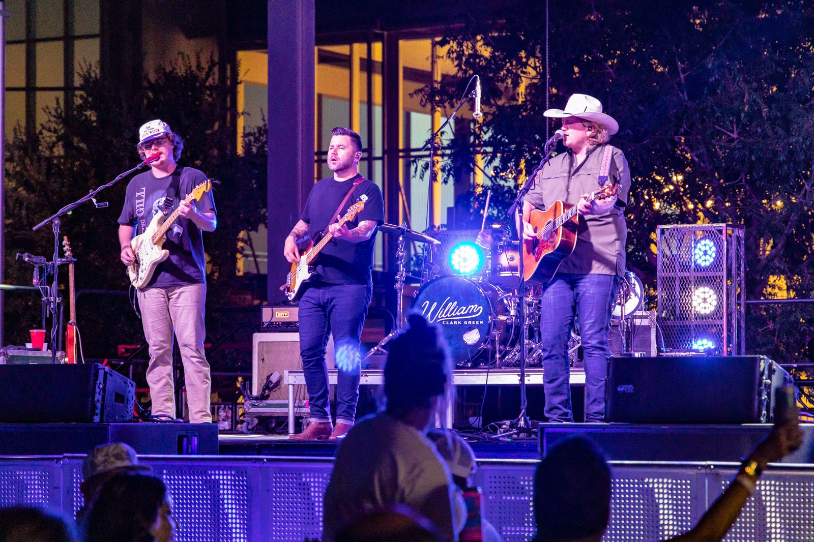 Band performing on stage at night in Centennial Park